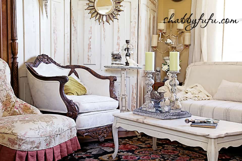 French country decor in Texas - french style living room sitting area with vintage couch, restored coffee table and upholstered sattine
