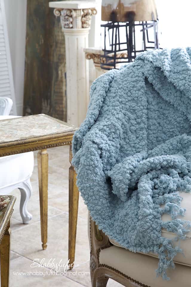 five minute styling tips - textured and soft blue throw blanket over a white upholstered coach