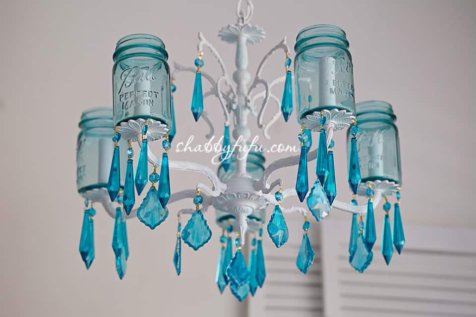 Adding pops of color to a room - aqua chandelier made with mason jars and blue crystals