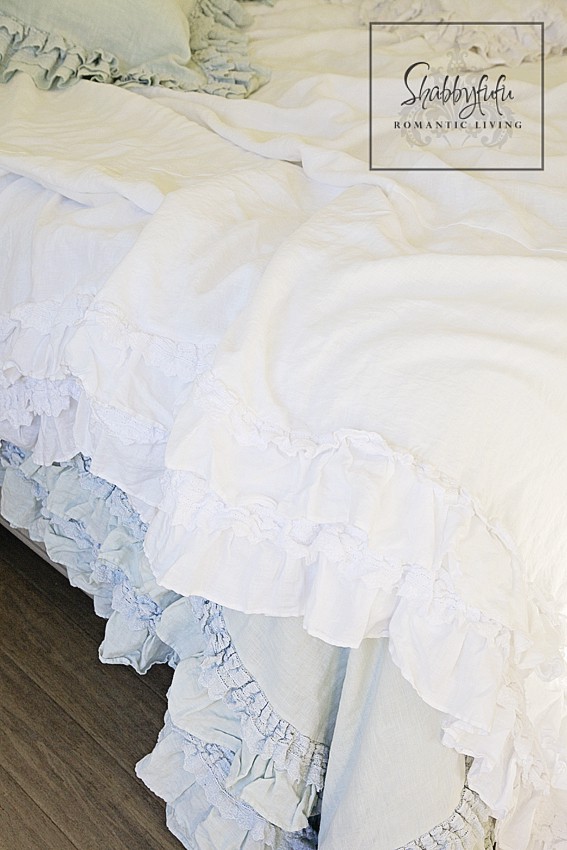 romantic room designs - soft white and blue ruffled bed linens