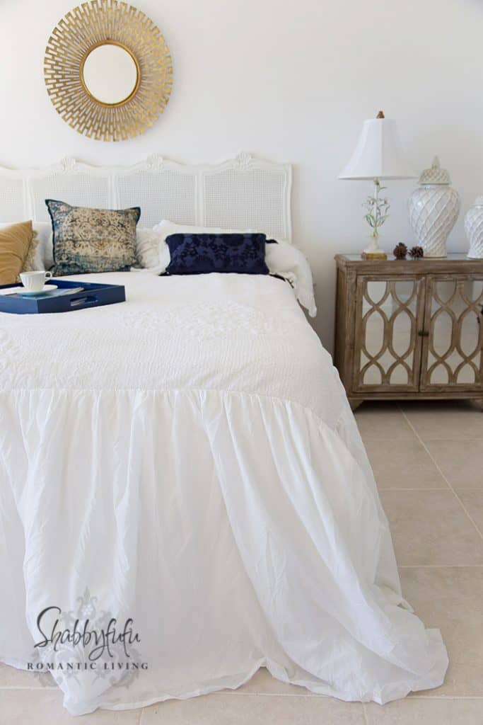 white coverlet with puddle skirt