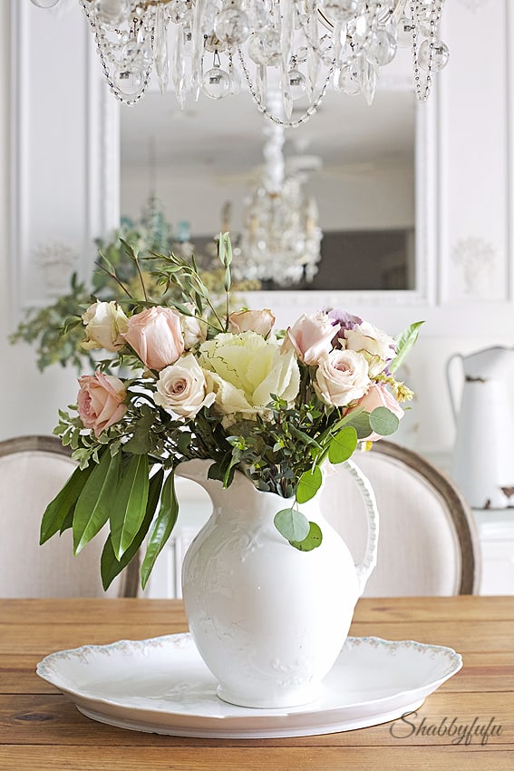 floral arranging in a shabby chic style on a farmhouse table