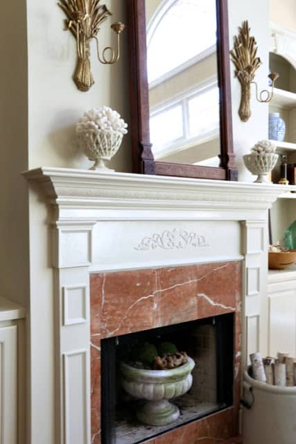 Creative Ways To Decorate With Shells shells on a mantel