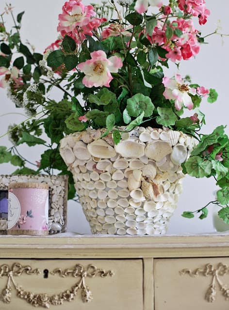 Creative Ways To Decorate With Shells seashell pot with flowers that you can make