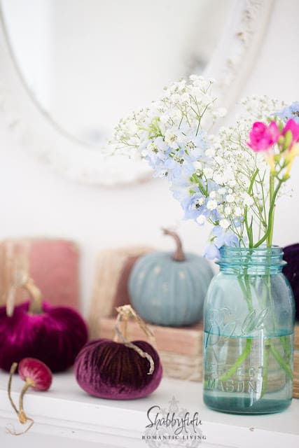 style a fireplace mantel with velvet pumpkins