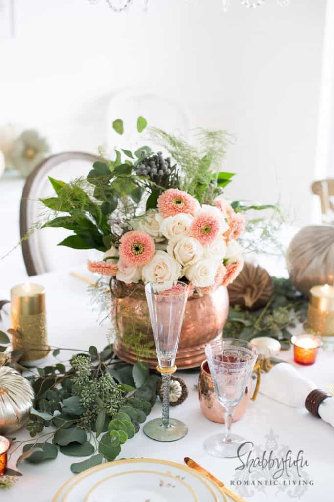 copper pot with flowers for table setting 