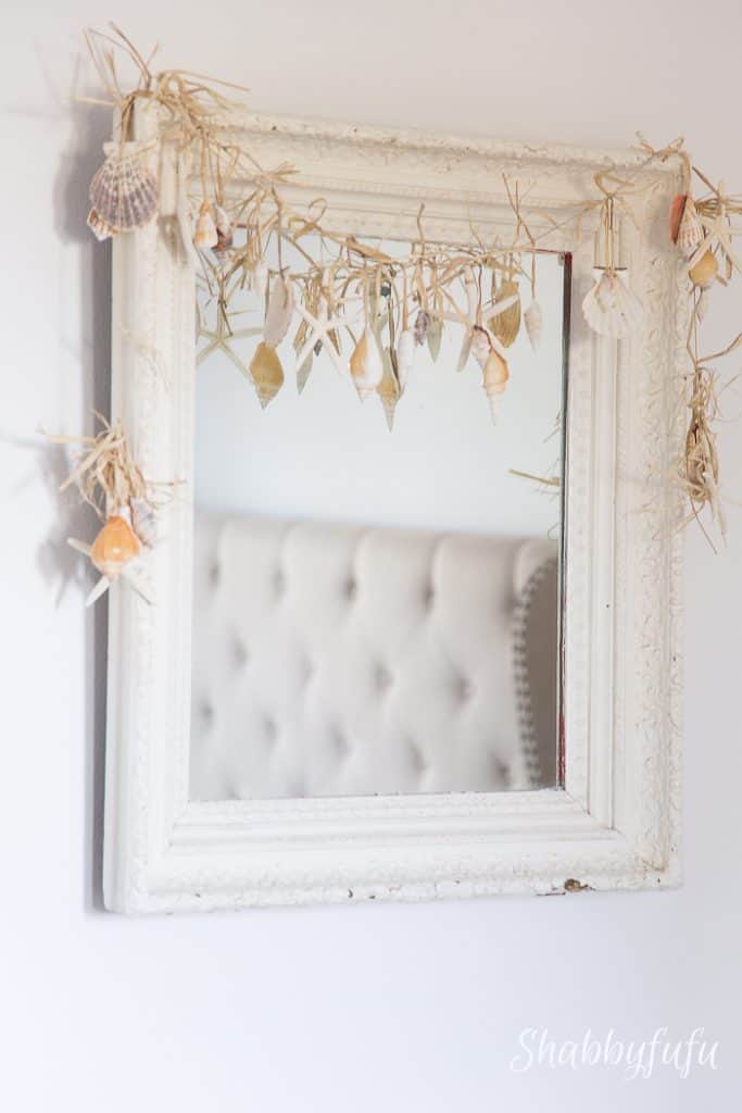 mirror with seashell garland