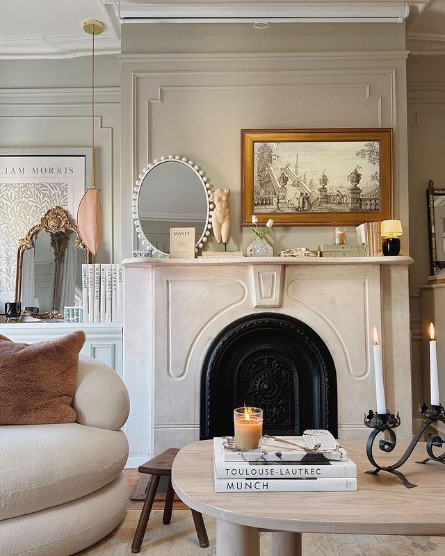 inspiration for how to shop in thrift stores for a beautiful home featuring a living room with a white fireplace