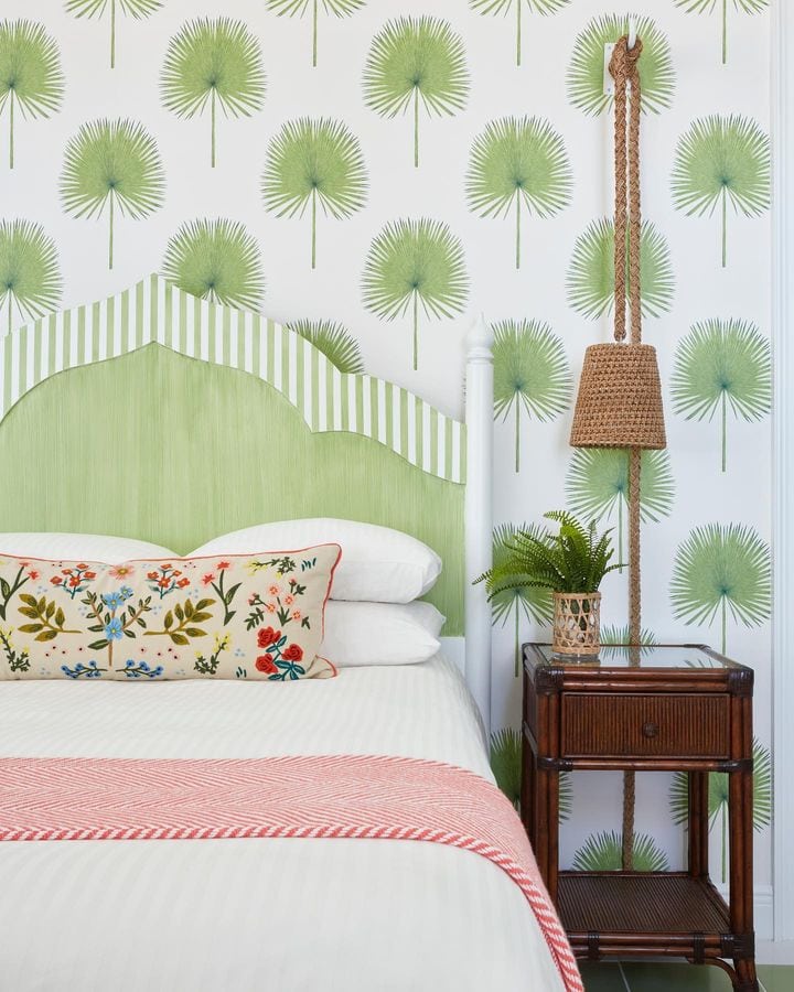 palm tree home decor trends featuring a bedroom with palm tree leaves wallpaper
