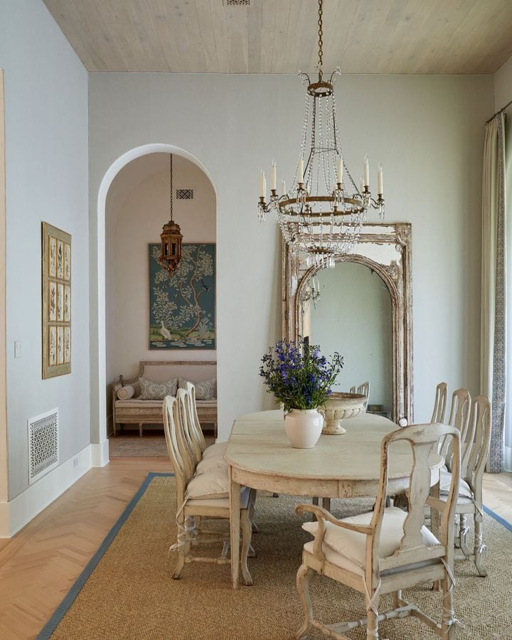 French country inspired dining room with traditional dining table and chairs