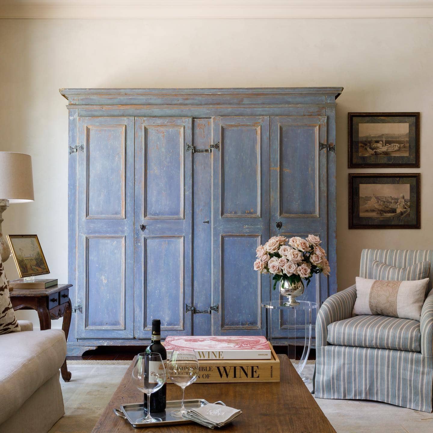 French country inspired living room with powder blue wood furniture and light blue armchair
