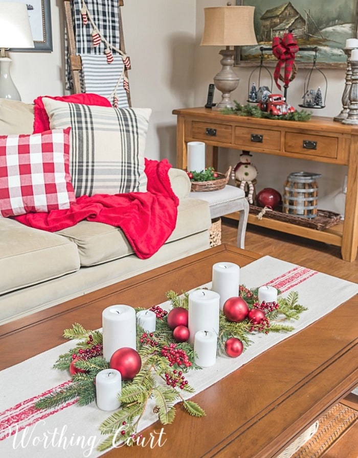 living room decorated in red and green for Christmas