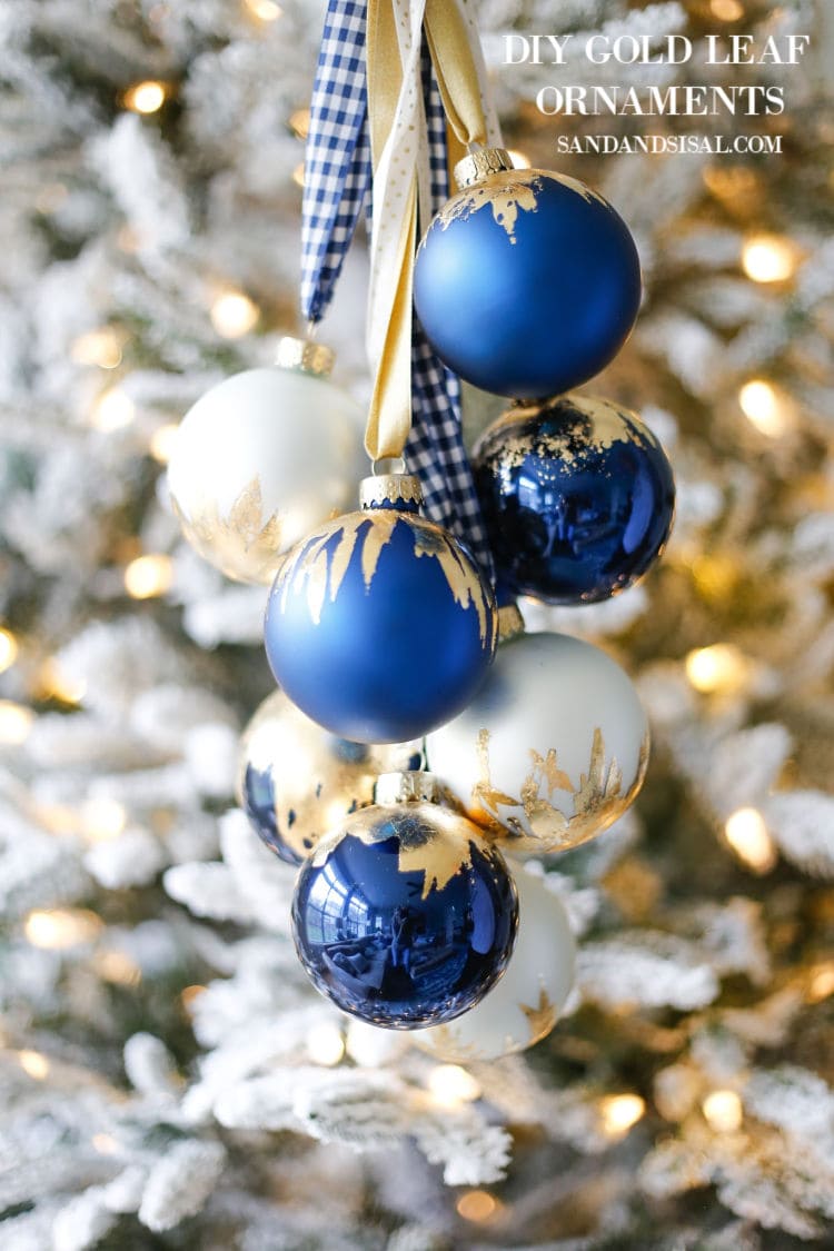 Up close picture of gold leaf on blue ornaments on the tree.