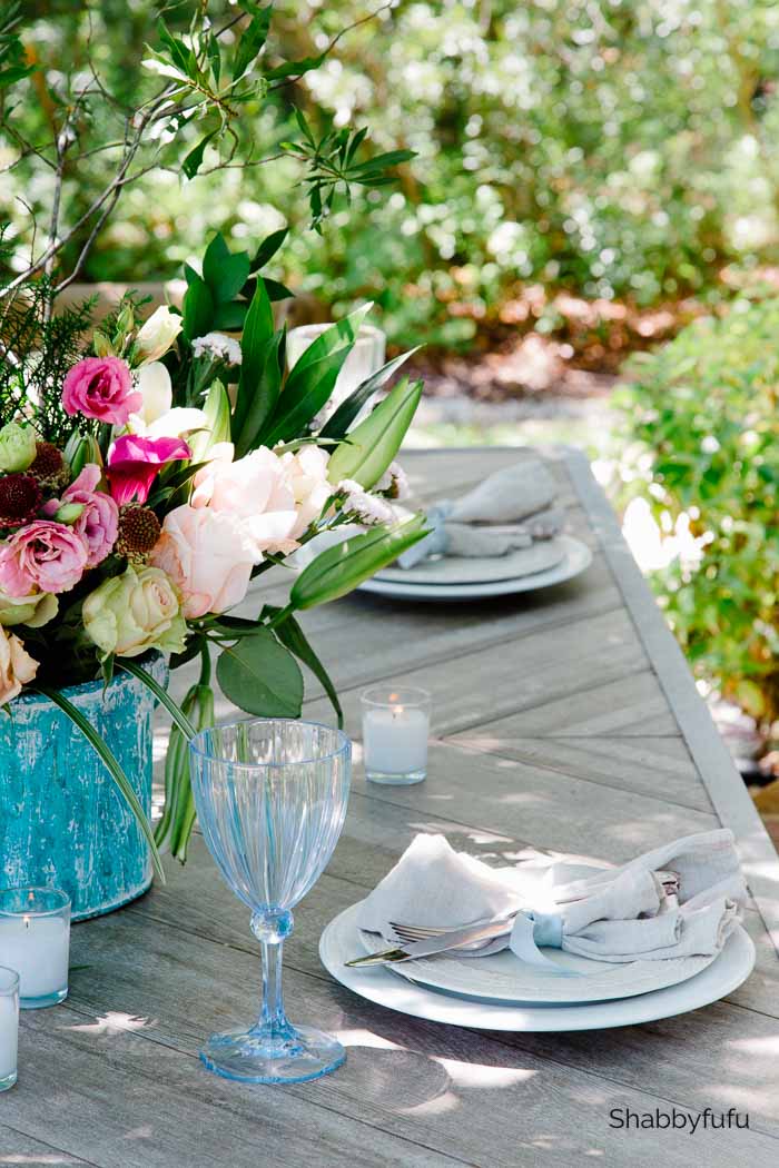 outdoor dining table setting and centerpiece
