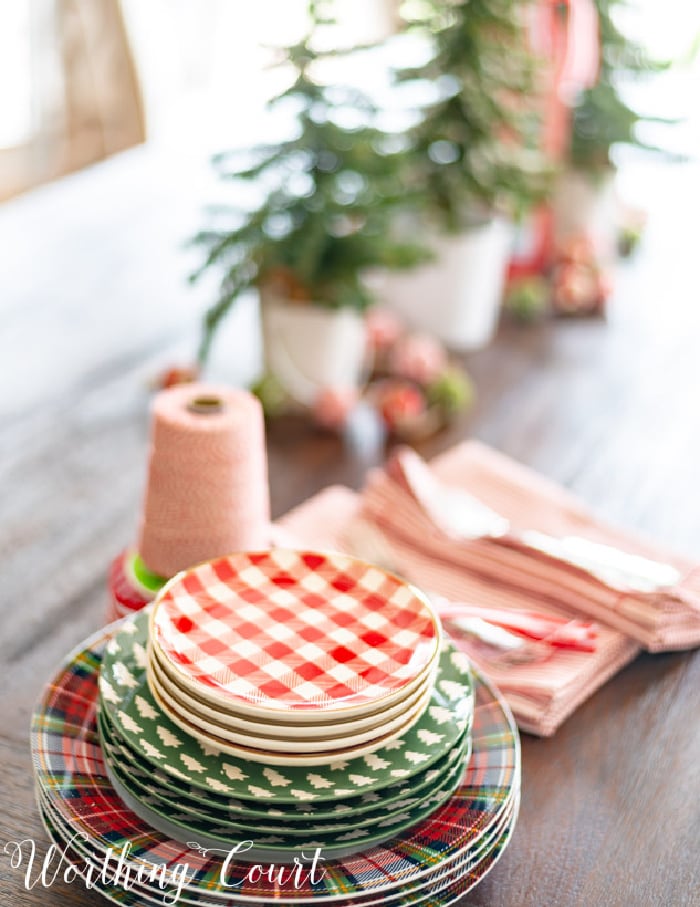 table with a stack of various Christmas dishes