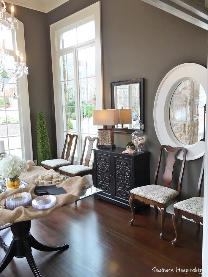 dining room with dark gray walls and traditional furnishings