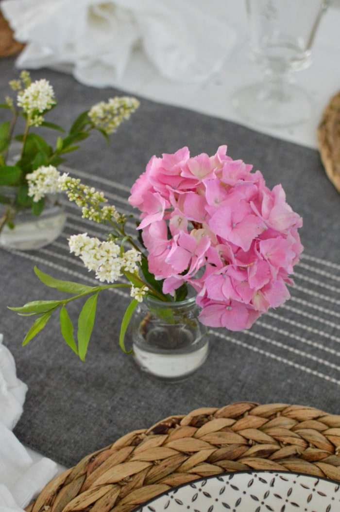 pink and white flowers in glass vases