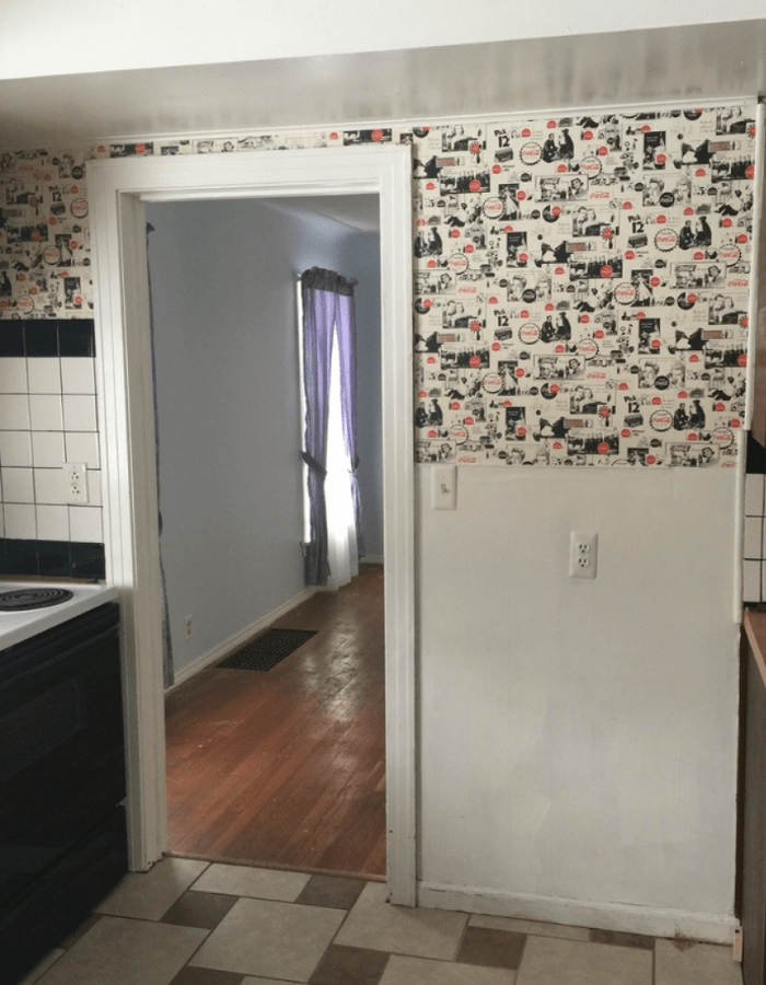 before picture of old kitchen with wallpaper with retro designs 50's 