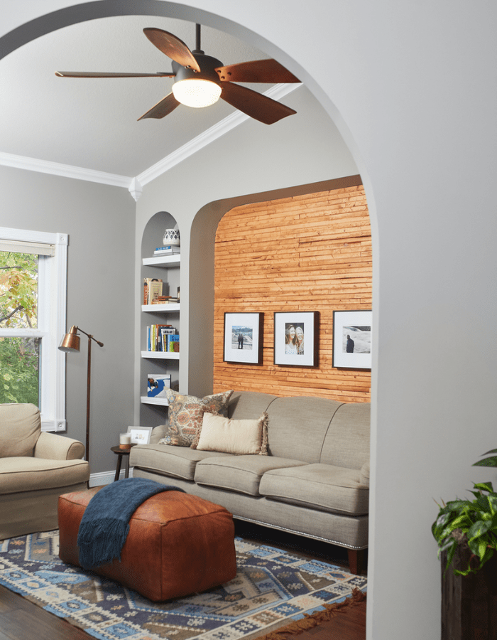 living room of DIY slat wood wall after picture with warm wood