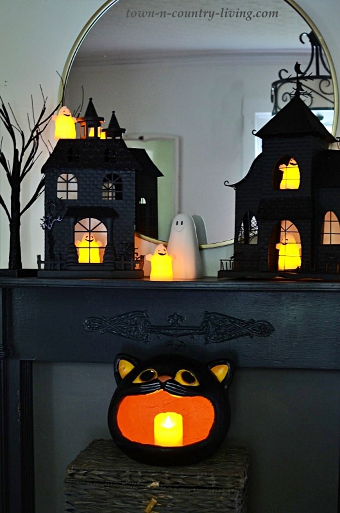 black mantel with spooky Halloween decor