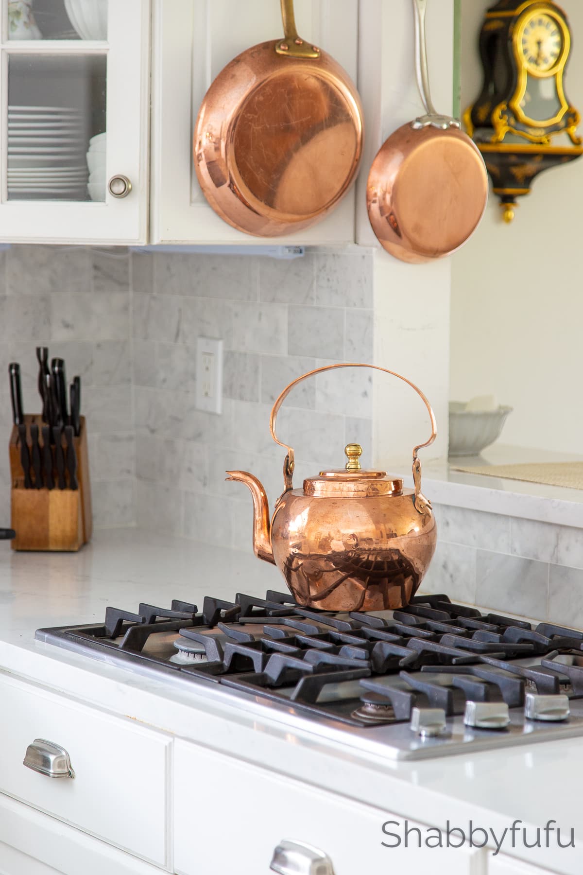 small space cozy kitchen with copper pots