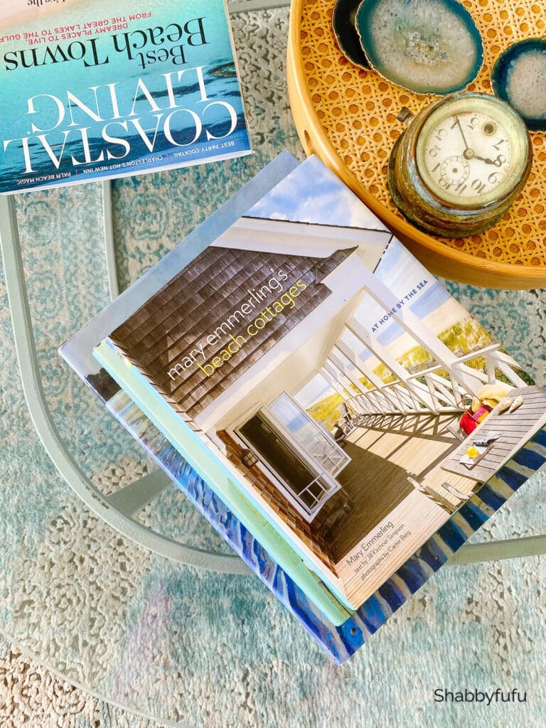decorating picture featuring decor books on a glass table