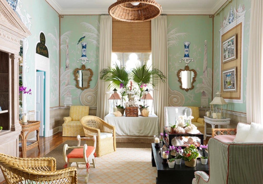 Palm Beach Regency Style living room with green wallpaper and tropical plants