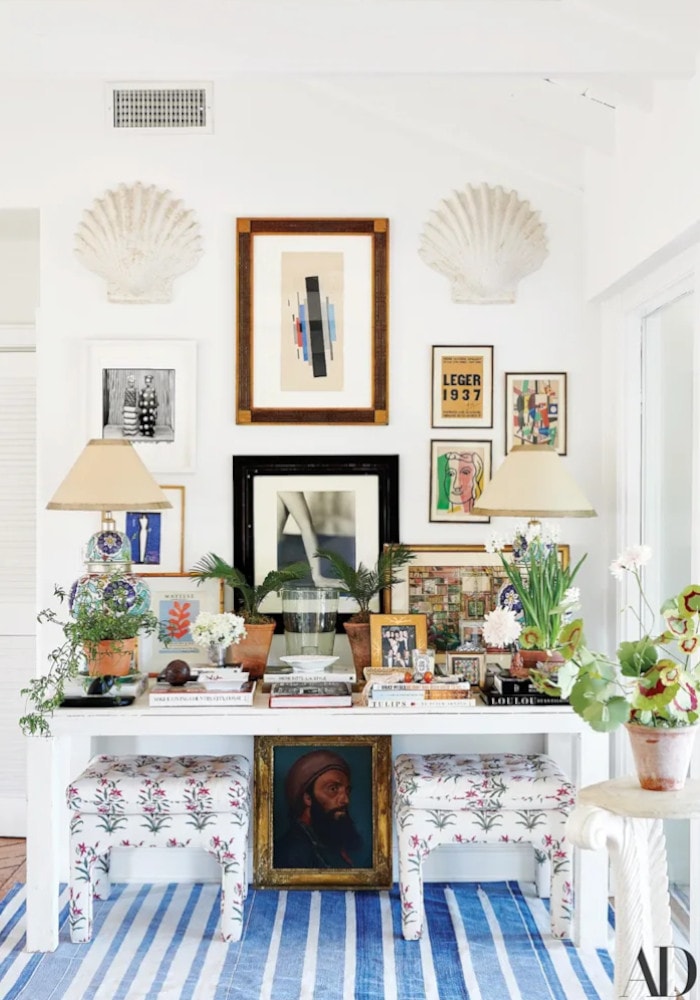 console table in white with gallery wall behind it at Rebecca de Ravenel's 