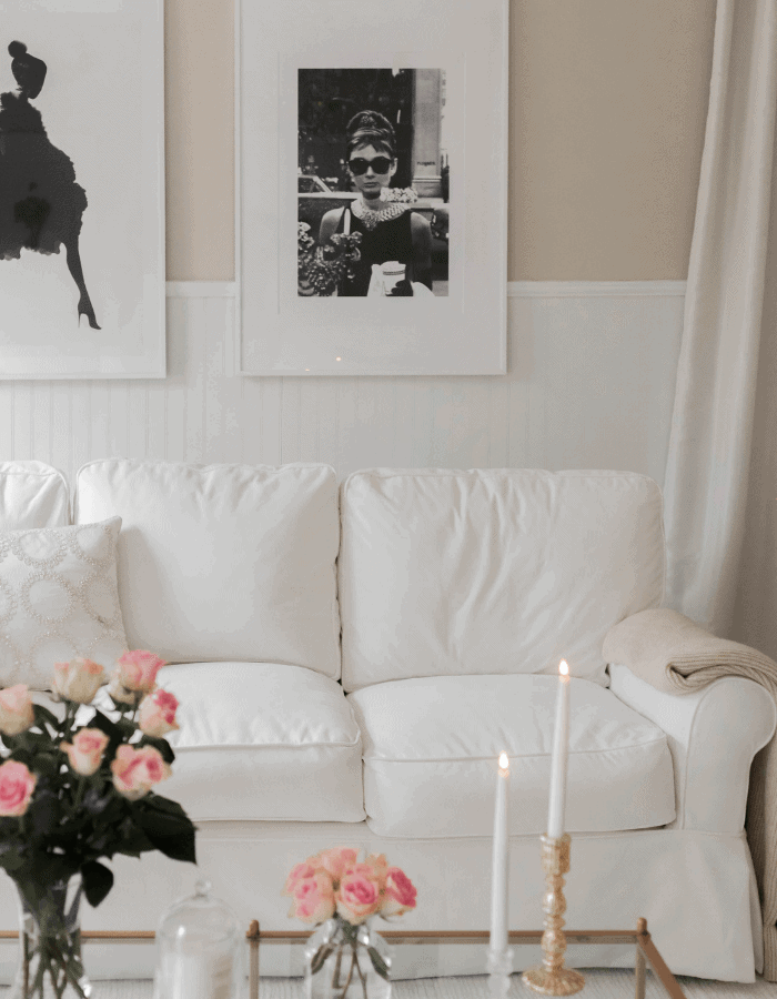 sophisticated french inspired living room featuring a black and white Audrey Hepburn picture