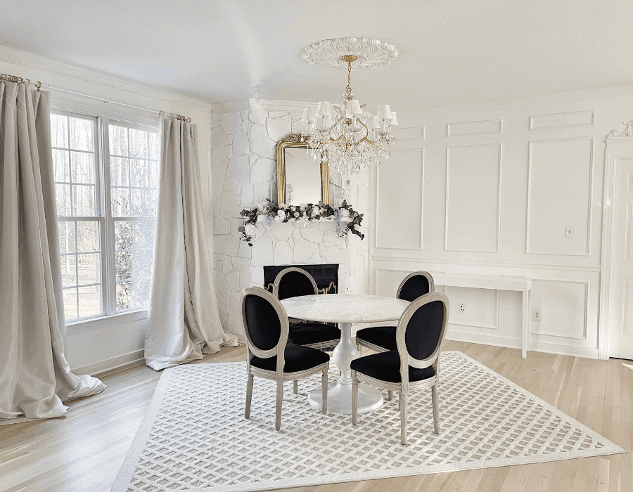 dining area featuring french regal inspired chairs and white round table Home Tour