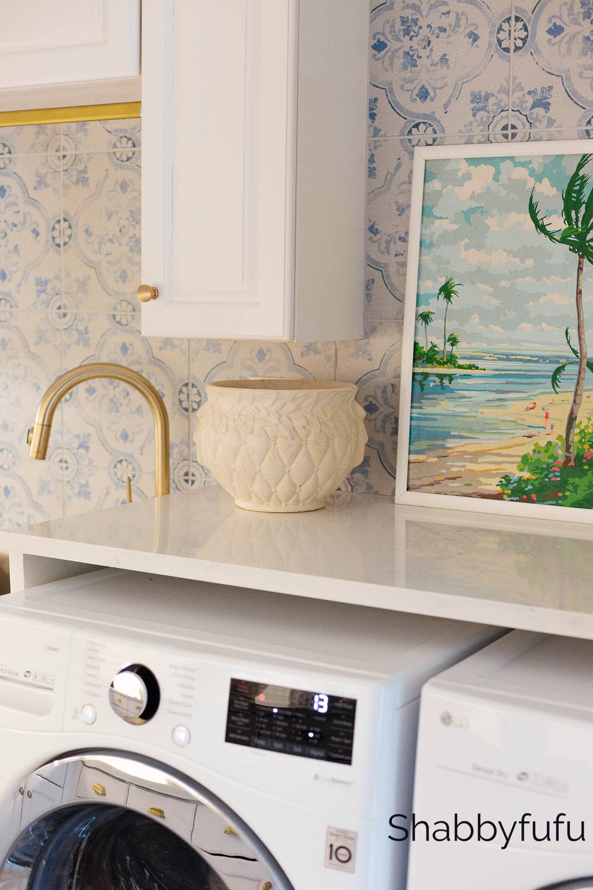 laundry room with vintage art