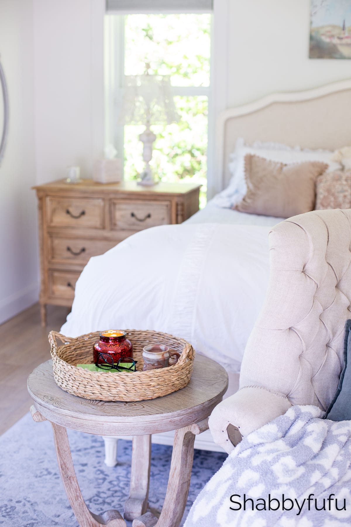 bedding styling idea in soft rusty pinks next to a natural wood nightstand to make your bed cozy for fall