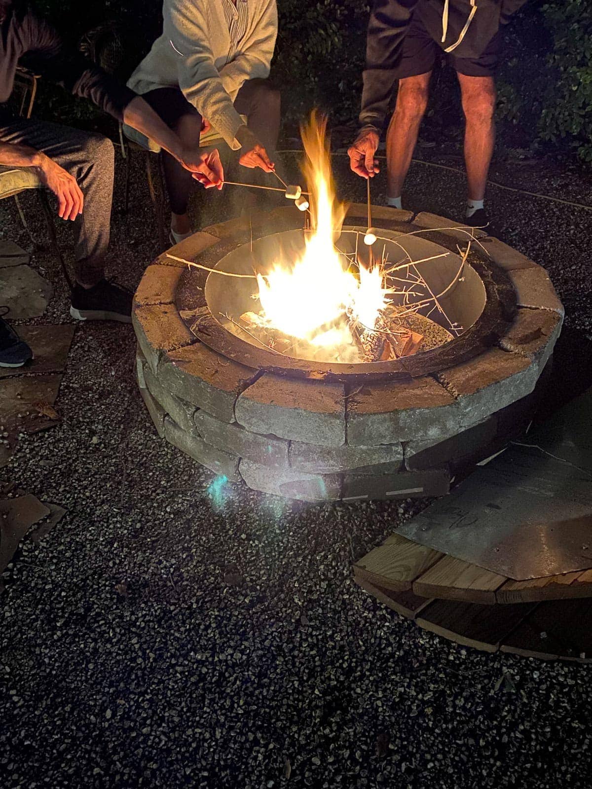 An Outdoor Fire Pit With A Cover & More