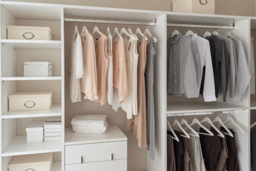 organized closet with stylish female clothes