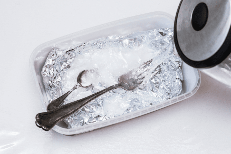 silverware items inside a clear container