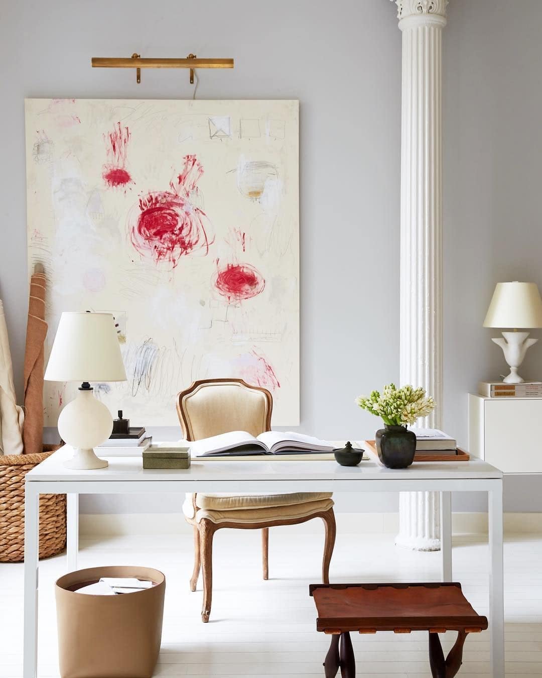 study room with a large floral painting in the background - great idea for making a home look expensive on a budget