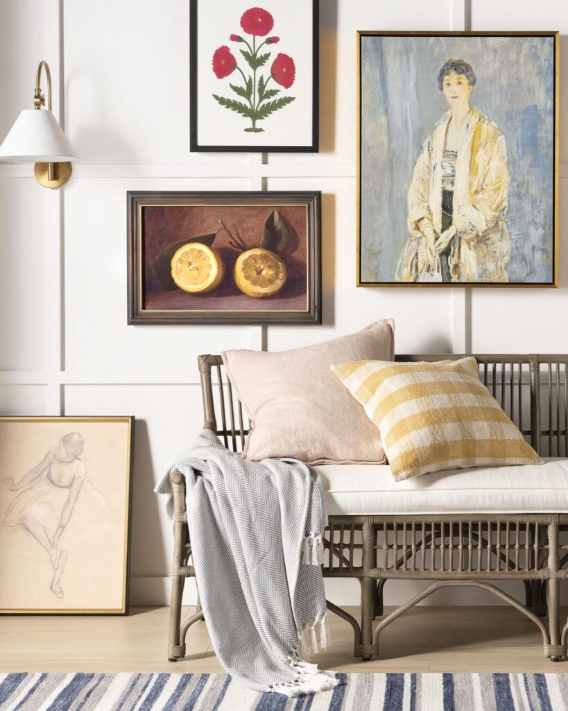 boho style sofa with a  gallery wall  in the background, featuring inspiration on how to arrange throw pillows