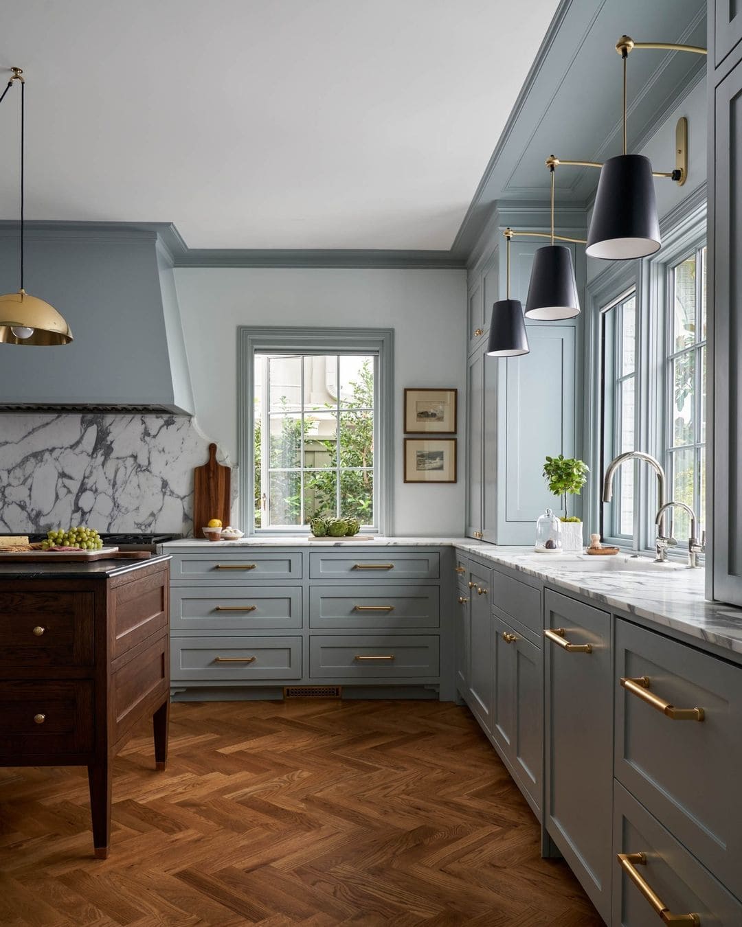 modern traditional kitchen with blue shades and wooden floors, balanced in scale and proportion
