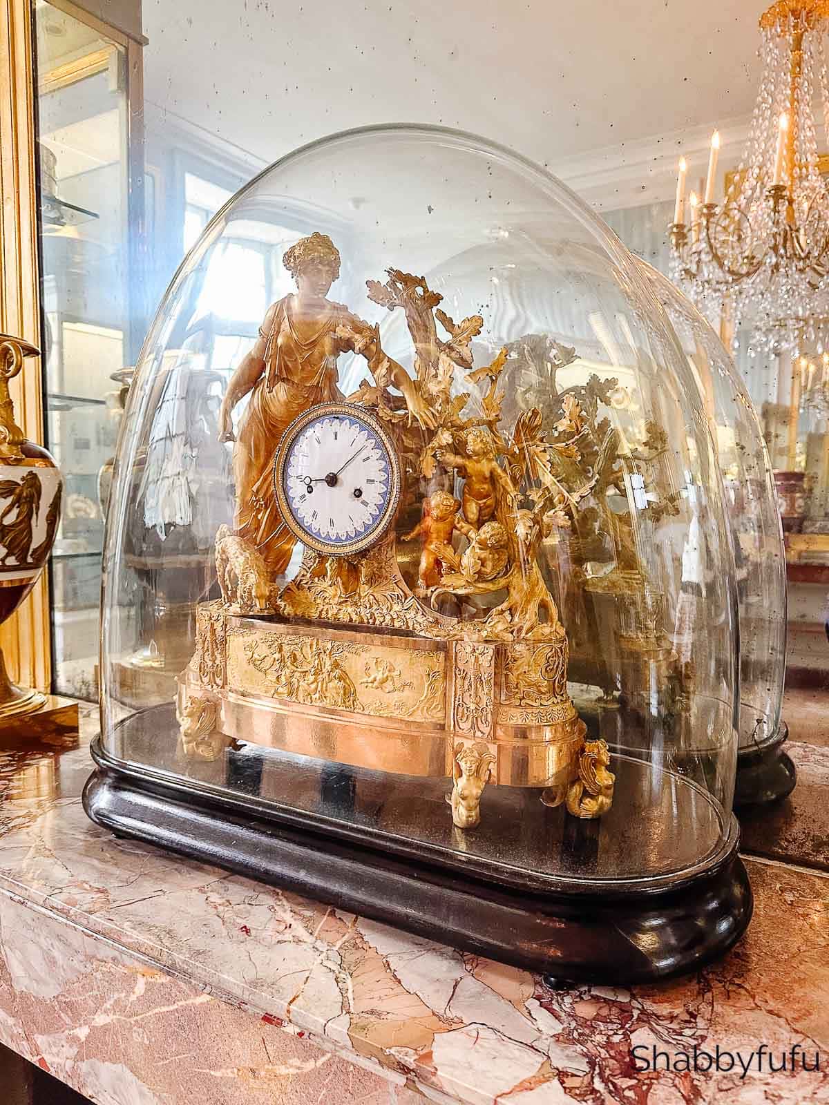 ornate gilded antique French clock at the Palace of Fontainbleau France