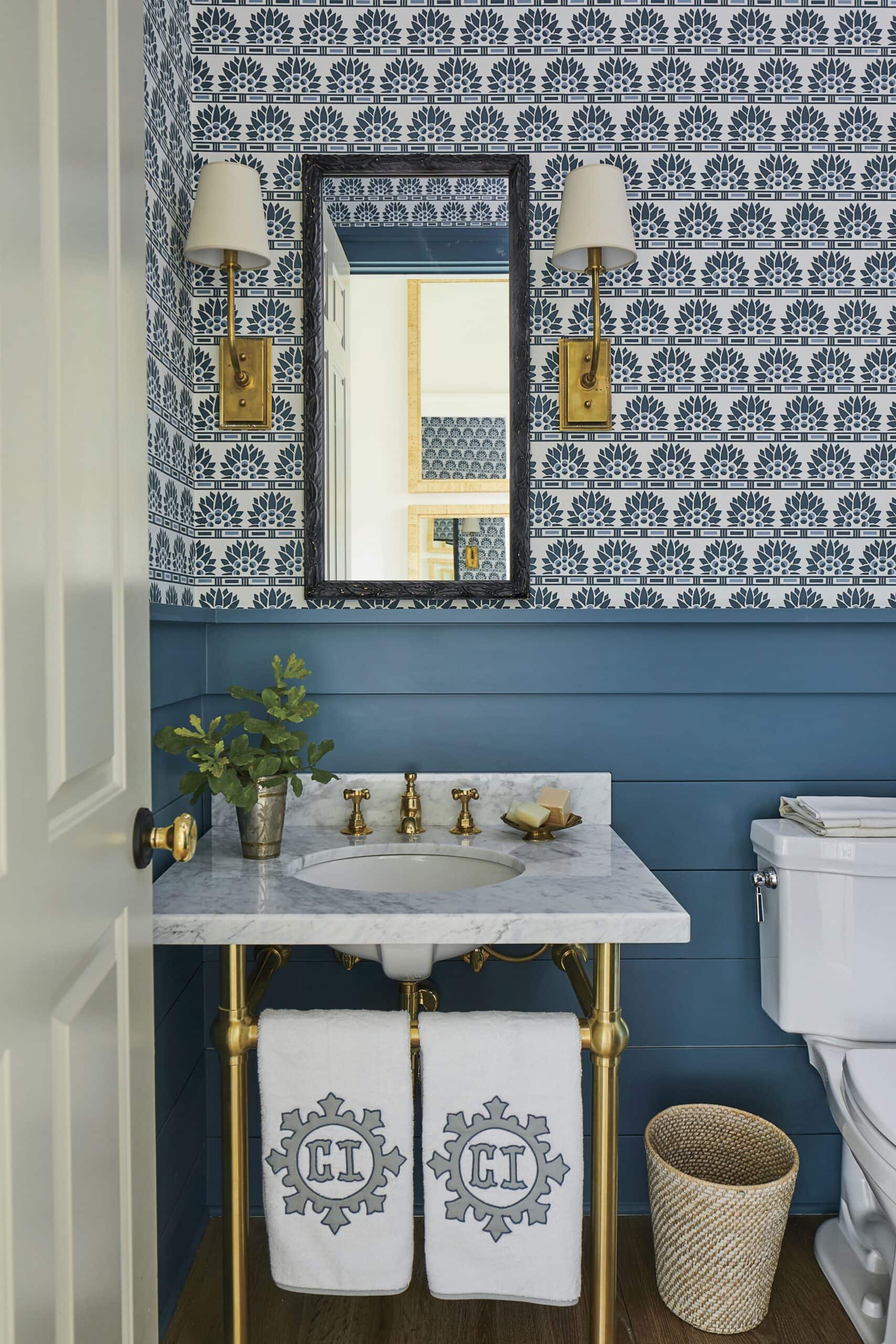 Powder room idea in coastal inspired home tour with blue and white walls