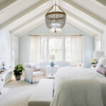 example of a beach style home, featuring a coastal bedroom in soft shades