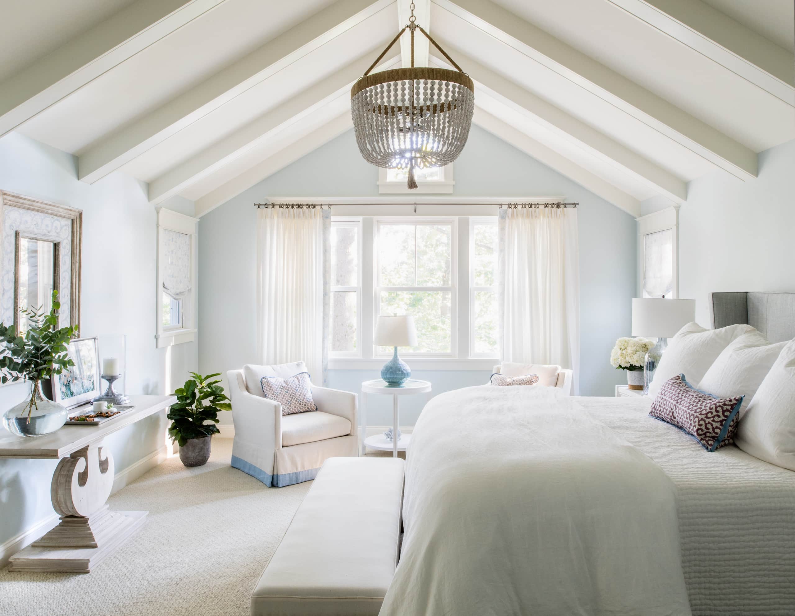 example of a beach style home, featuring a coastal bedroom in soft shades