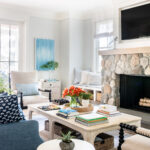 idea of coastal cottage living room featuring fireplace
