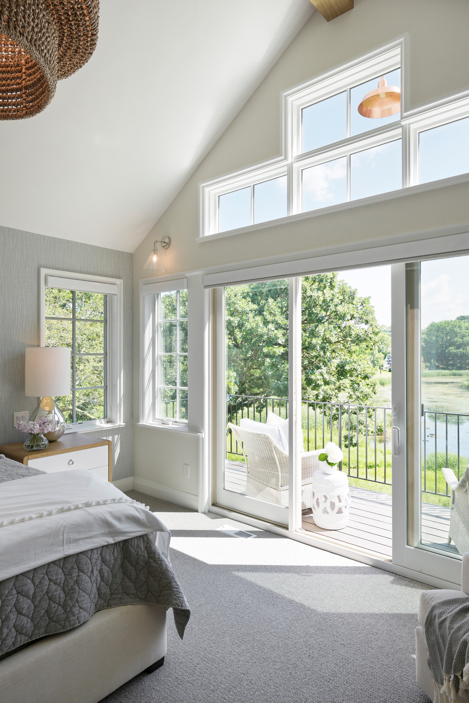 cottage coastal bedroom  featuring a private balcony in the background