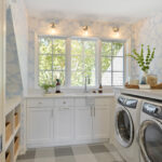 cottage coastal laundry featuring wallpaper and check patterned floorings