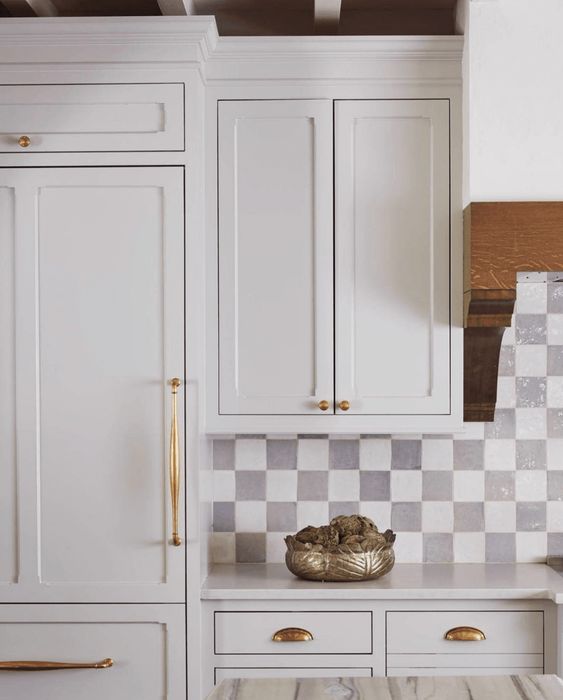 modern elegant kitchen featuring a checkered glossy tiles in white and grey