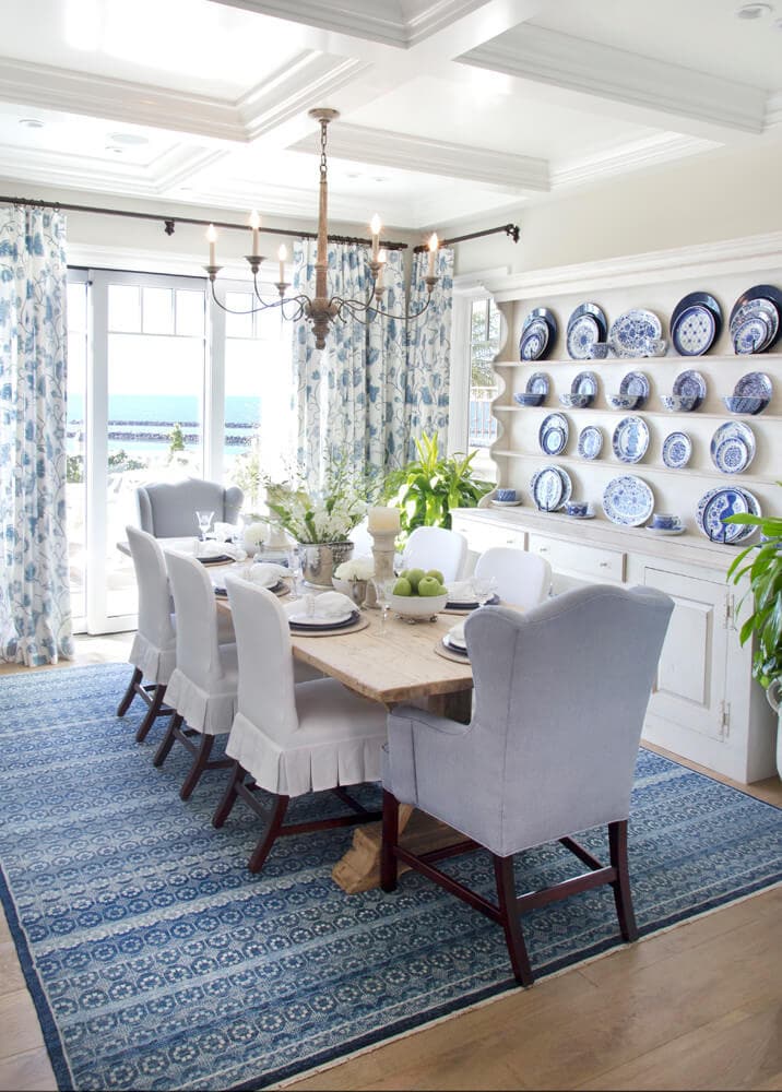 main dining room idea from a cozy coastal home tour featuring white and blue decor