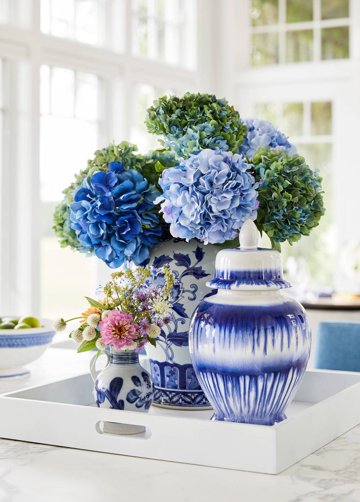 vases in white and blue chinoiserie with floral arrangements