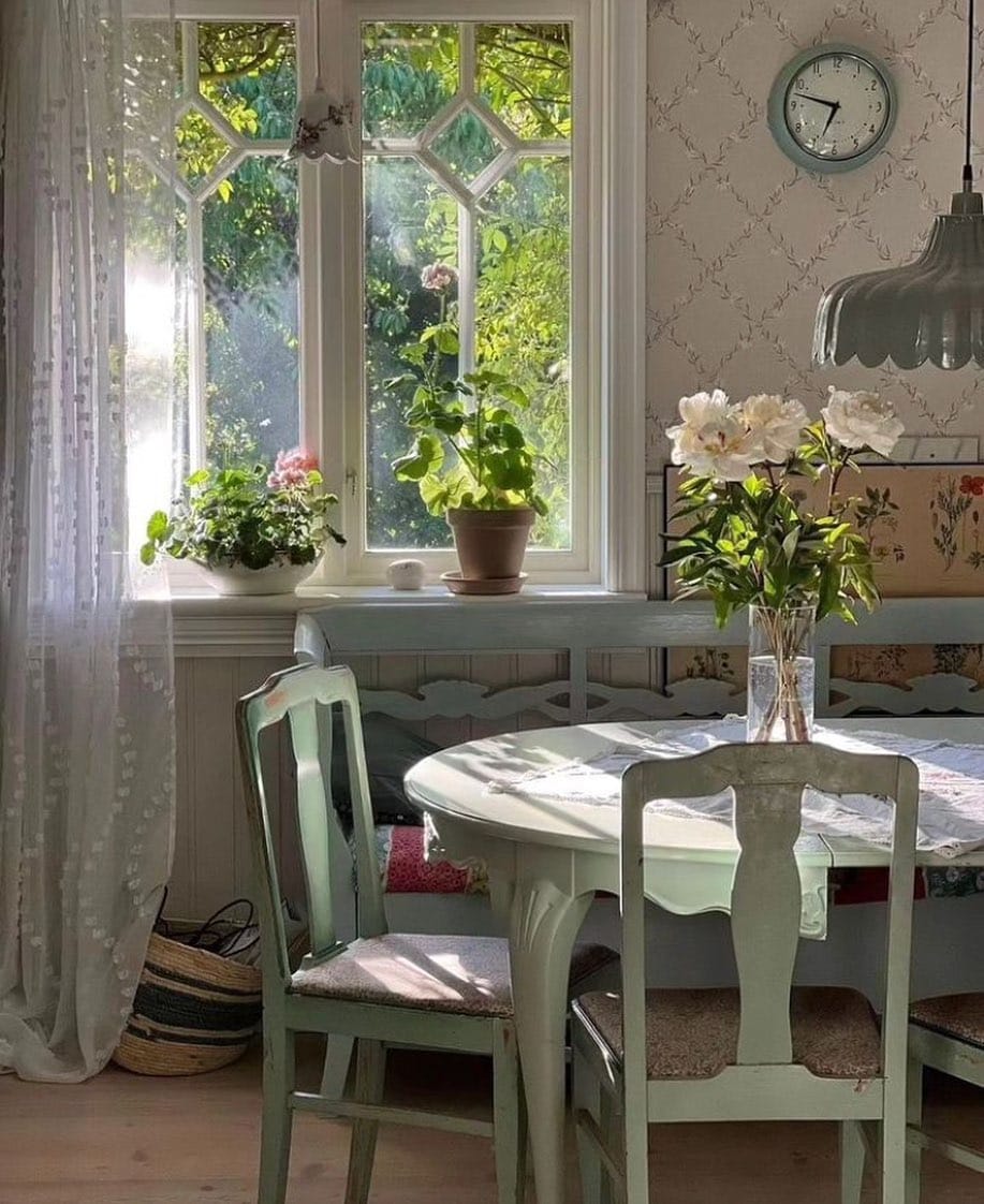 table next to windows in a rustic cottage