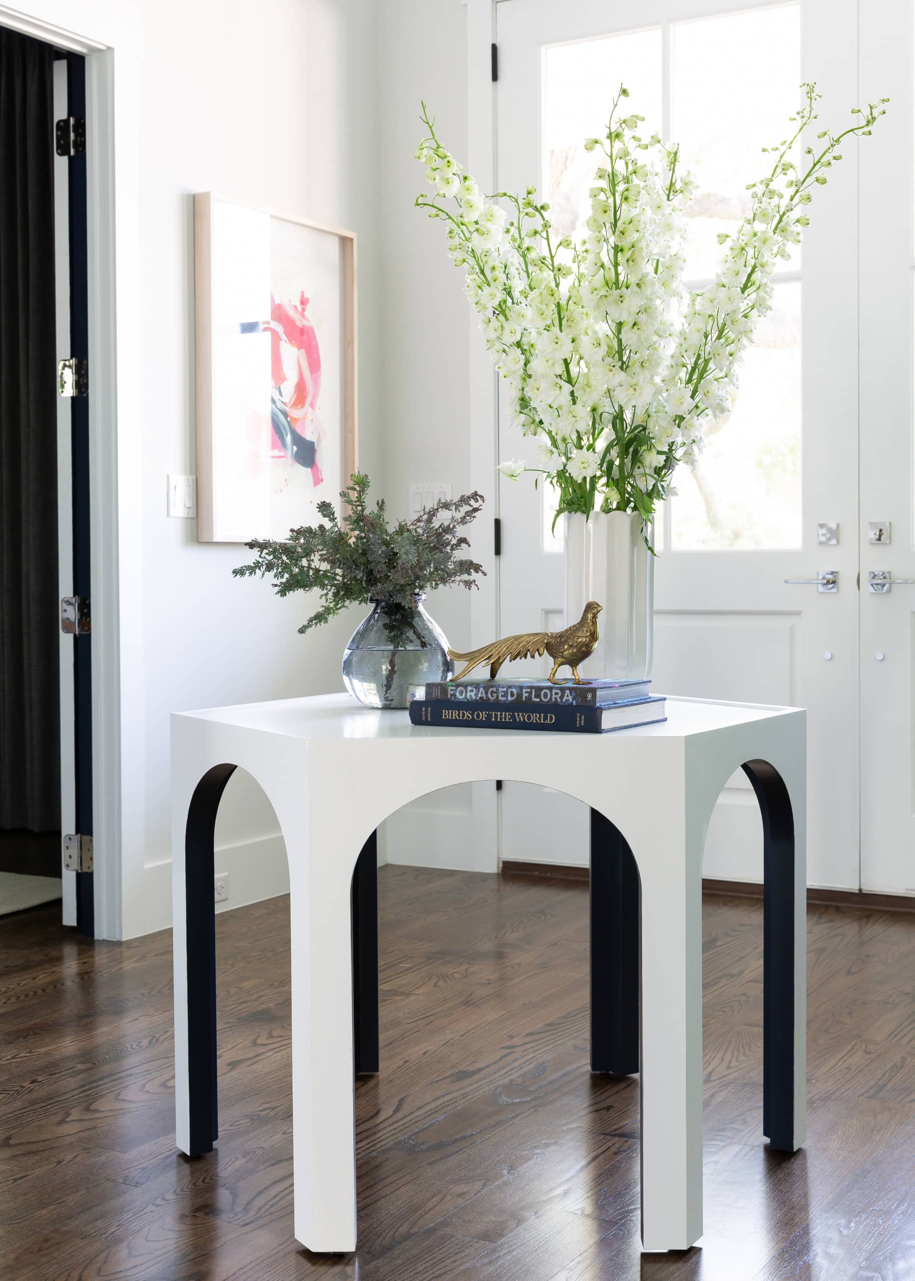 a two toned table on a entryway, coastal home tour idea